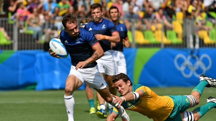France's Terry Bouhraoua scores a try in the men’s rugby sevens match between Australia and France.