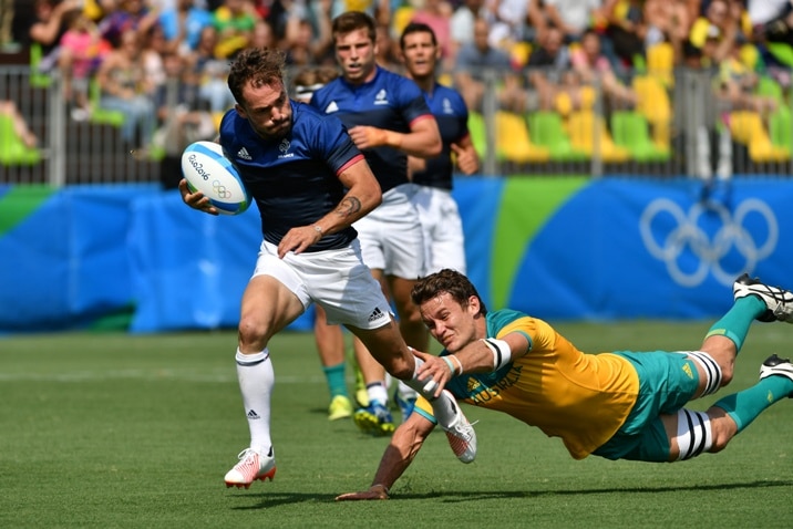 France's Terry Bouhraoua scores a try in the men’s rugby sevens match between Australia and France.