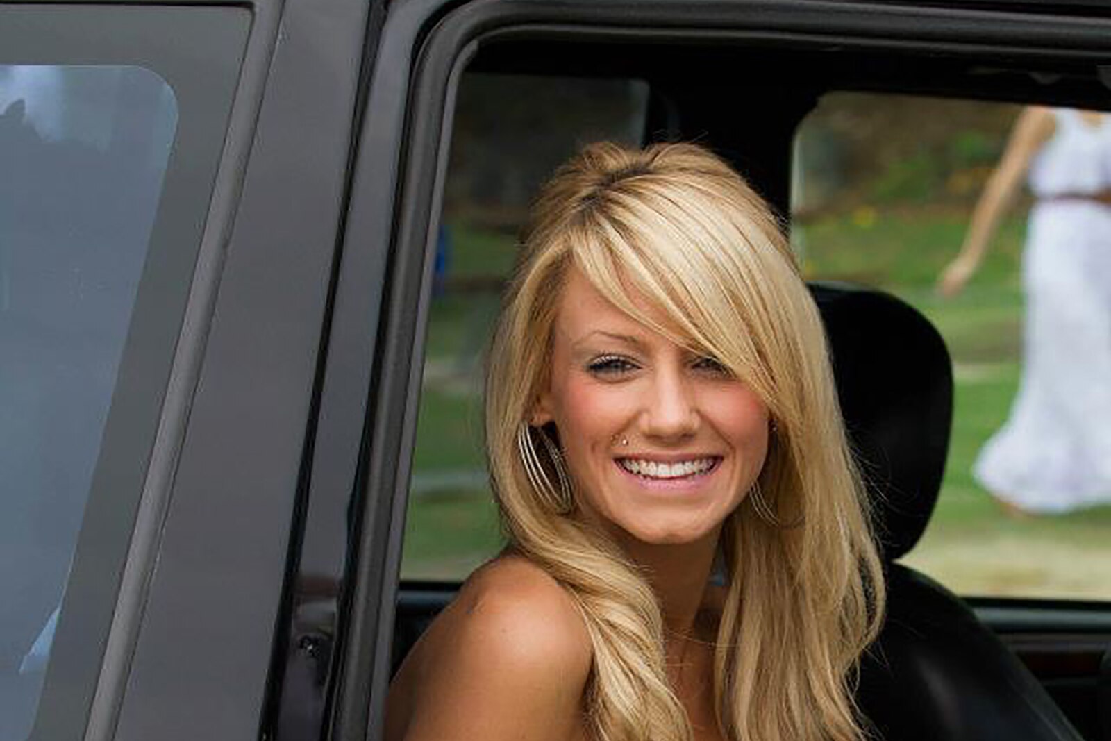 Missing woman Jessica Zrinski smiling while sat in a car