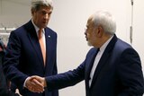 John Kerry shakes hands with Iran's Foreign Minister