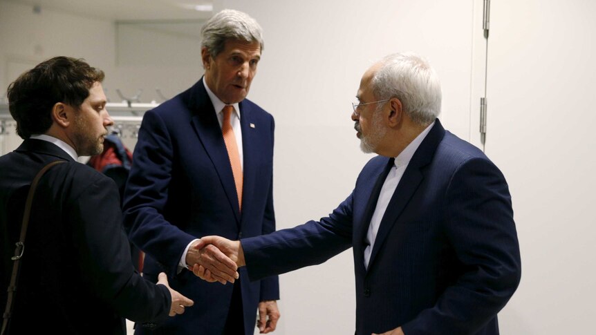 John Kerry shakes hands with Iran's Foreign Minister