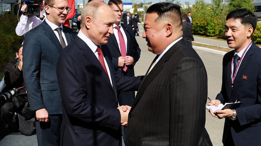 Kim and Putin shaking hands 