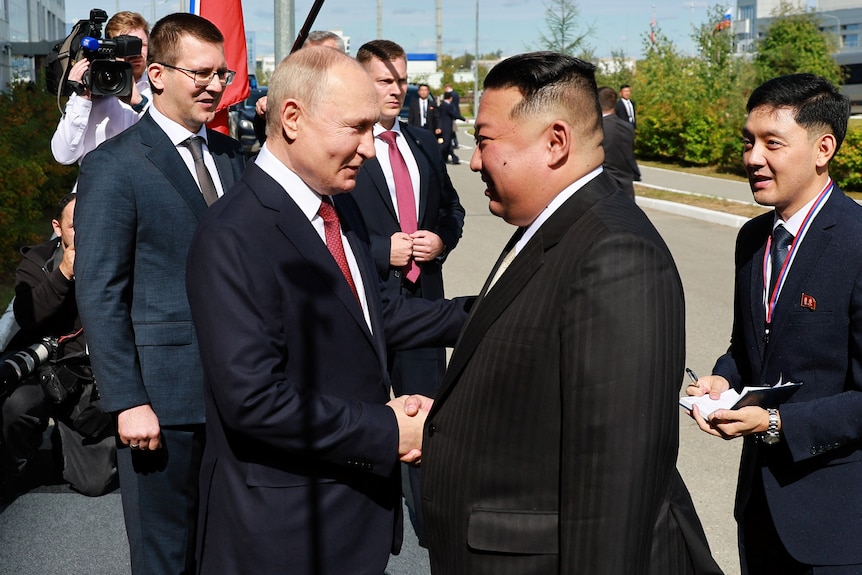 Kim and Putin shaking hands 