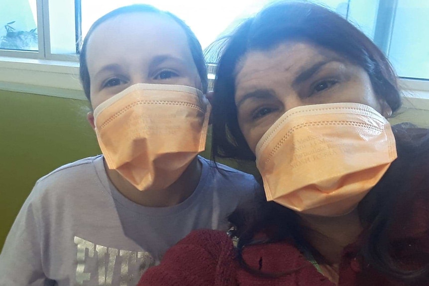 Linny Carney and daughter Taylor wearing masks.