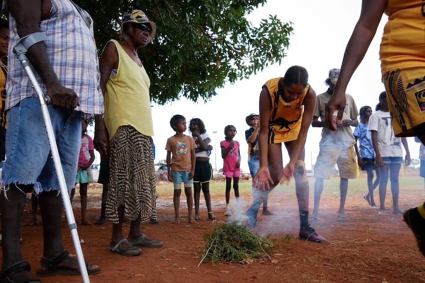 A smoking ceremony at a football match in Bidyadanga June 2022. 