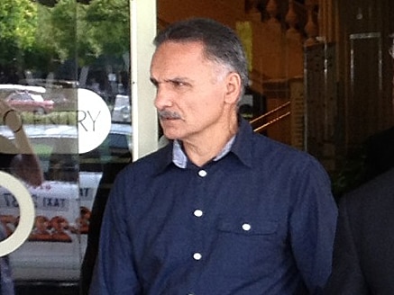 John Mouhalos outside court