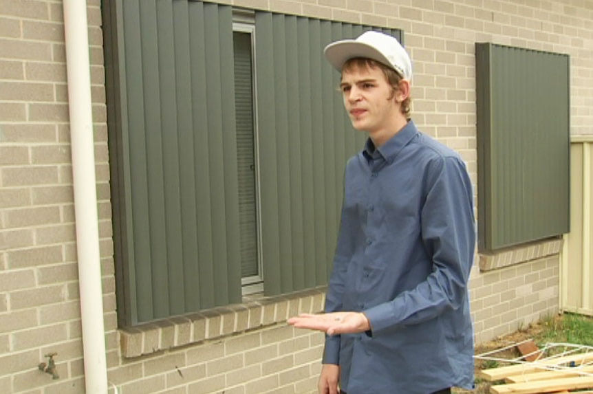 Cade Matheson holds the shrapnel from a bullet at the home in Queanbeyan.