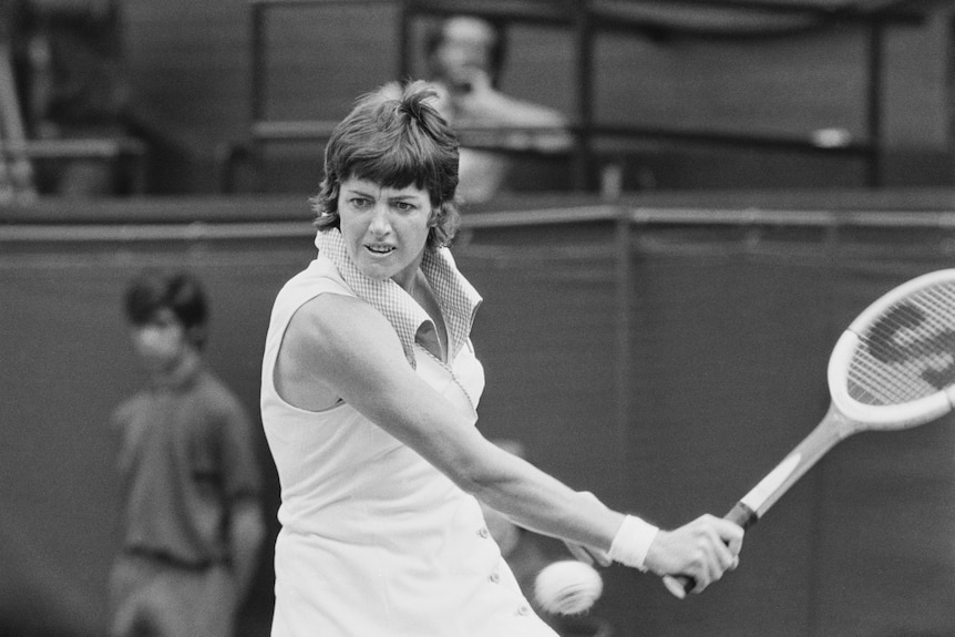 Margaret Court goes to hit a backhand shot.
