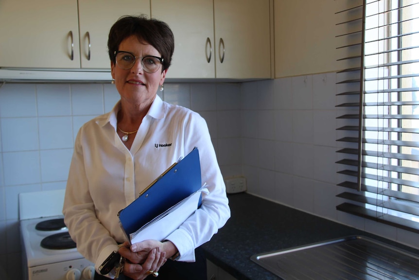 Cheryl Bennett stands in a kitchen