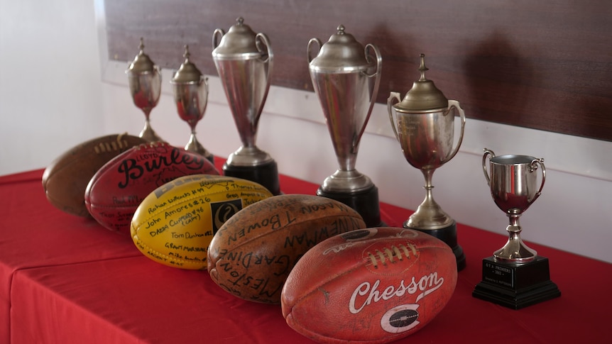 Football trophies and memorabilia.