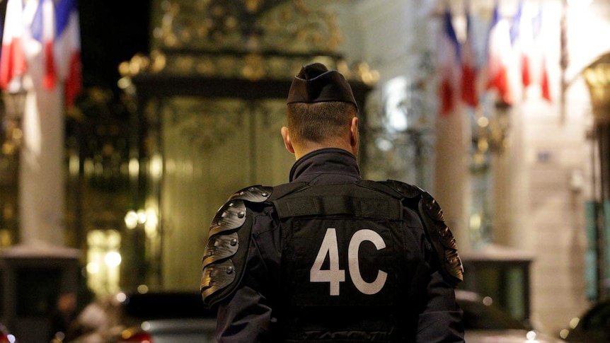 Police officer stands guard outside French Interior Ministry