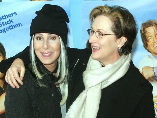 Actresses Cher (L) and Meryl Streep pose at a film premiere