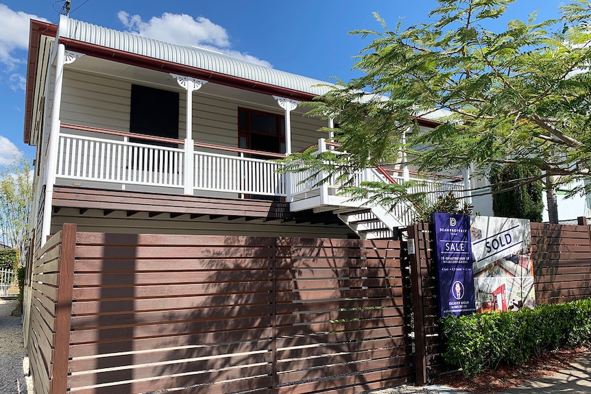 Old wooden house with Sold sign at Woolloongabba.
