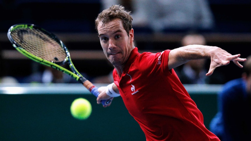 Richard Gasquet hits a forehand against Denis Istomin at the Paris Masters