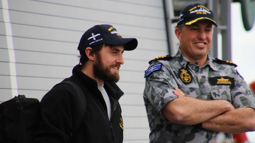 Gregor McGuckin with Commanding Officer of HMAS Ballarat Paul Johnson.