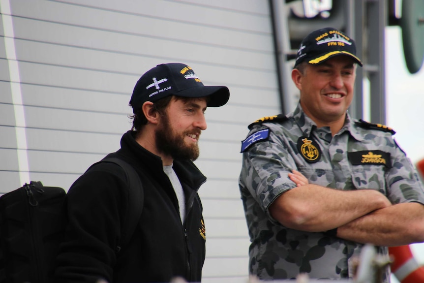 Gregor McGuckin with Commanding Officer of HMAS Ballarat Paul Johnson.