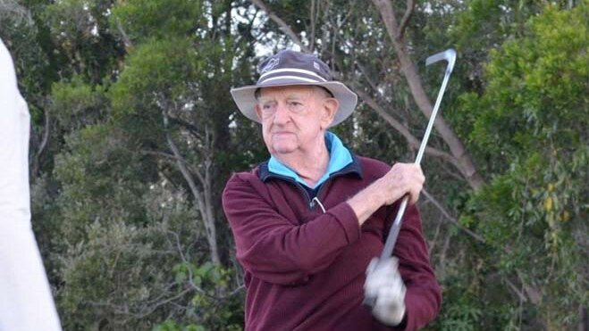 old man playing golf