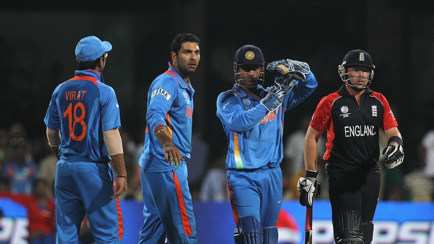 Play it again ... MS Dhoni was unhappy with the not out decision against Ian Bell (r).