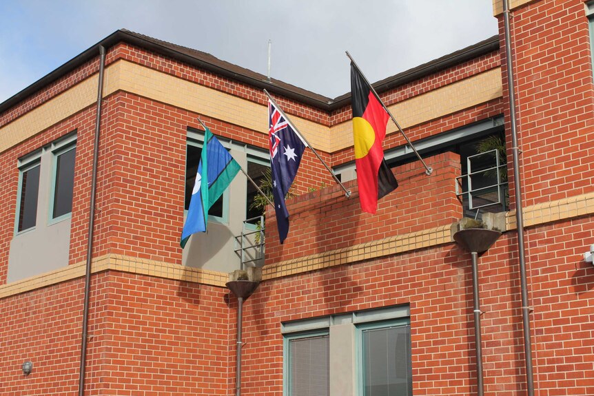 The Albury Police Station has hung an Aboriginal flag alongside the Torres Strait Islander and Australian flags.