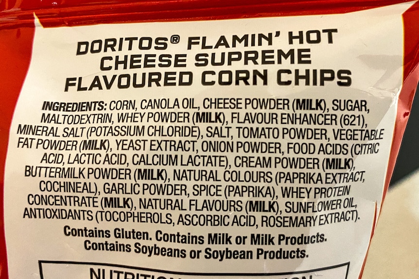 A list of ingredients on a packet of Doritos.