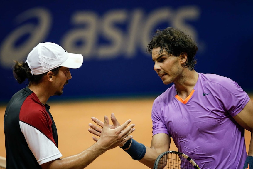 Into the final ... Rafael Nadal (R) shakes hands with Argentina's Martin Alund.