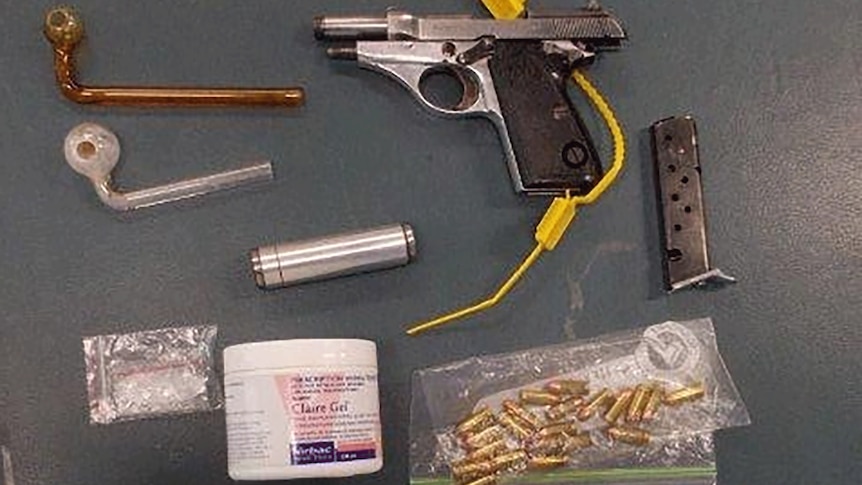 A pistol, bullets, silencer and drug paraphernalia seized by Gold Coast police