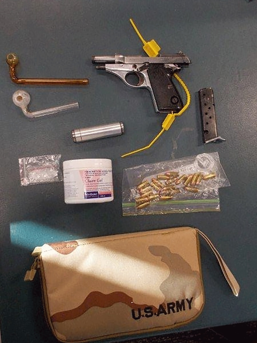 A pistol, bullets, silencer and drug paraphernalia seized by Gold Coast police