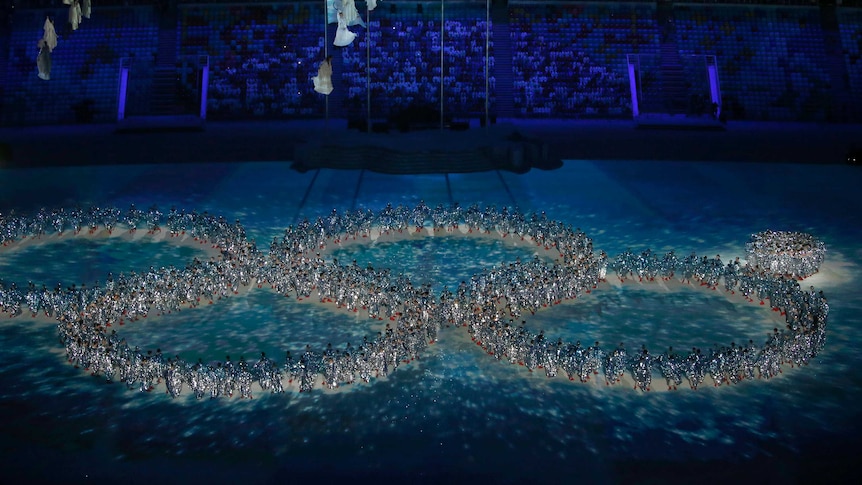 Dancers make the Olympic rings at the Sochi closing ceremony