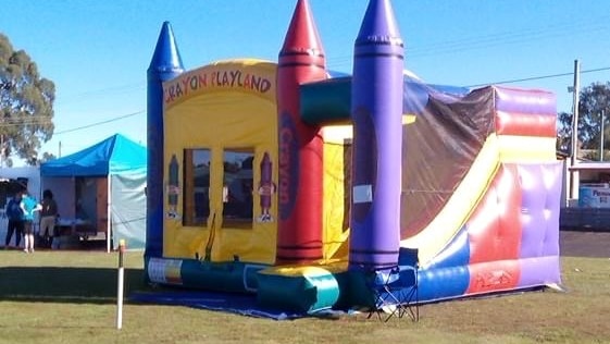 A colourful inflatable plastic jumping castle