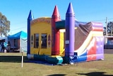 A colourful inflatable plastic jumping castle