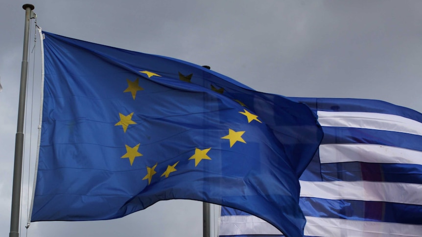 The EU and Greek flag fly in front of the Parthenon