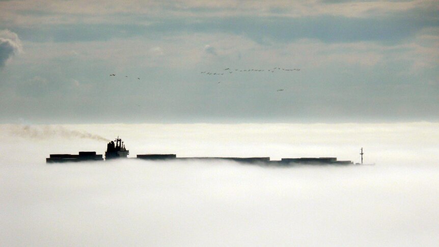 A ship makes its way through heavy fog near McCrae