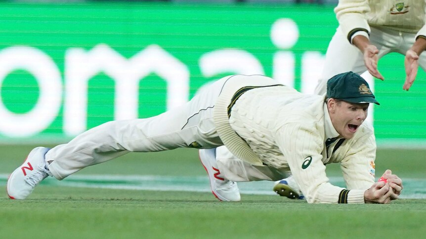 Australia's Steve Smith takes a catch in a Test against Pakistan.