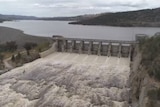 aerial view of a dam overflowing
