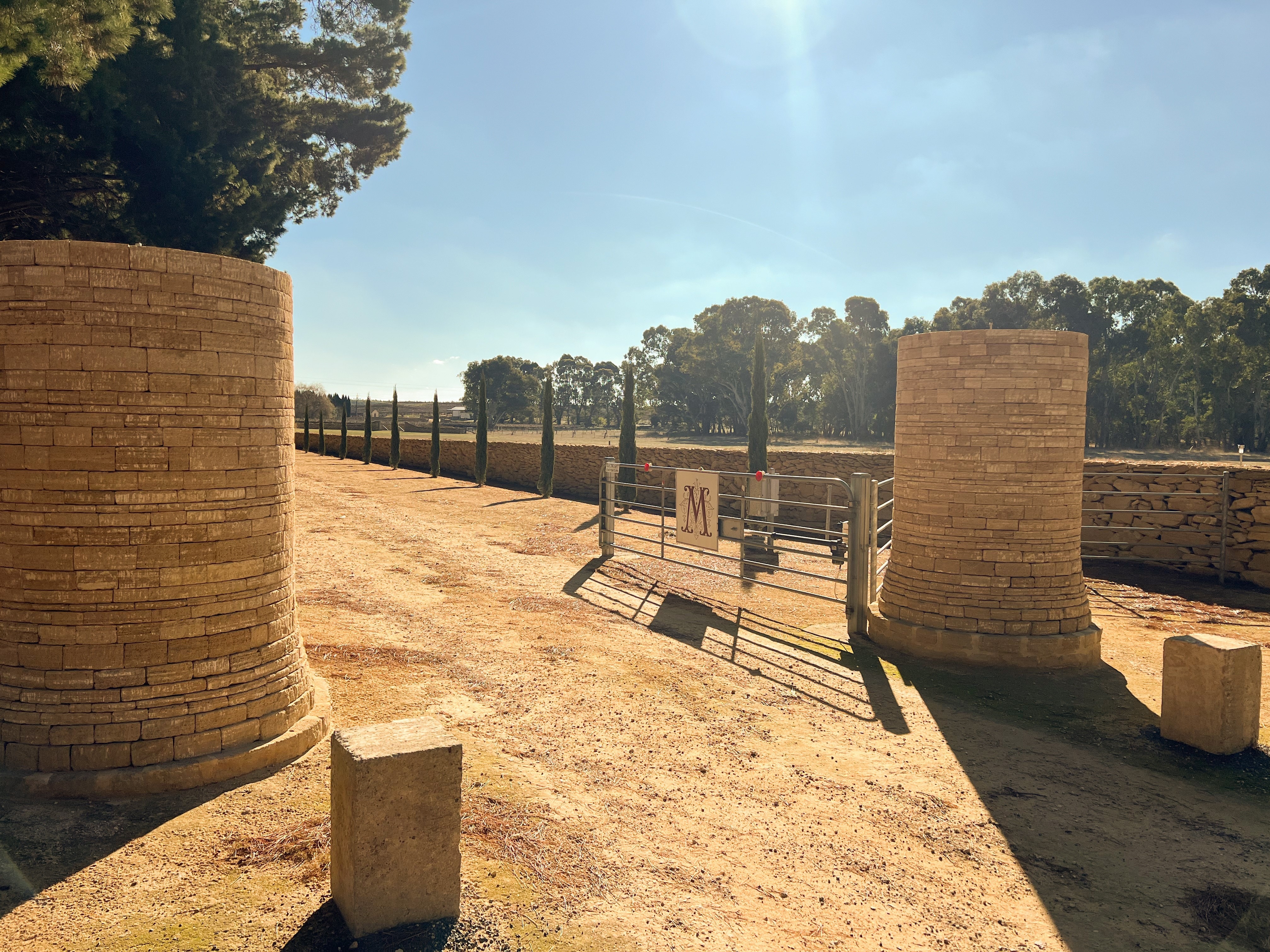 Sandstone sculptures at a driveway entrance in rural South Australia