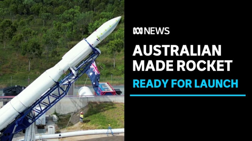 Australian Made Rocket, Ready for Launch: A rocket on a crane leans diagonally.