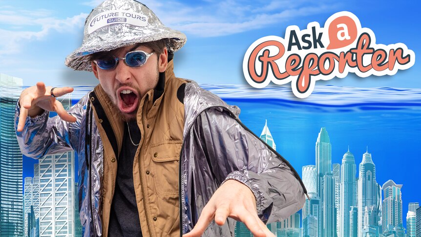 Josh dressed up as a futuristic tourist guide pulls a freaked out face. A city underwater in the background.