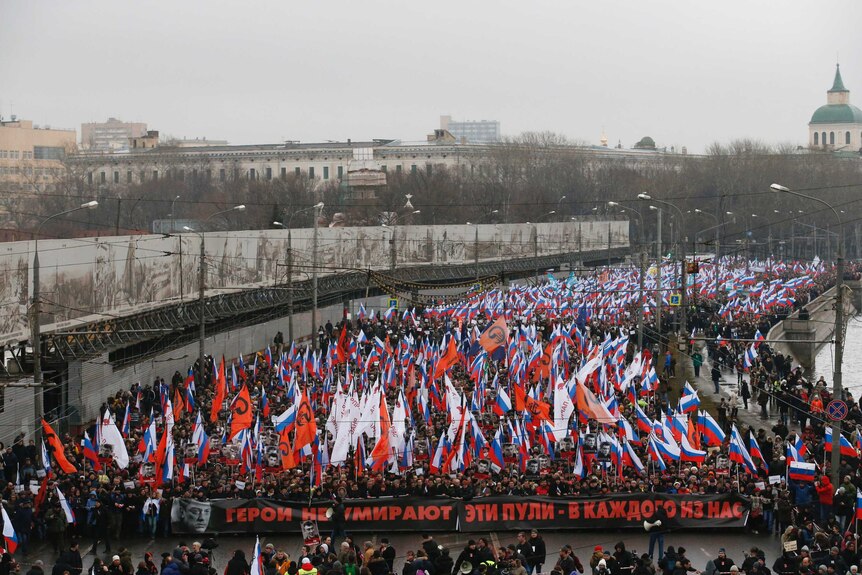 People march in central Moscow to commemorate Kremlin critic Boris Nemtsov