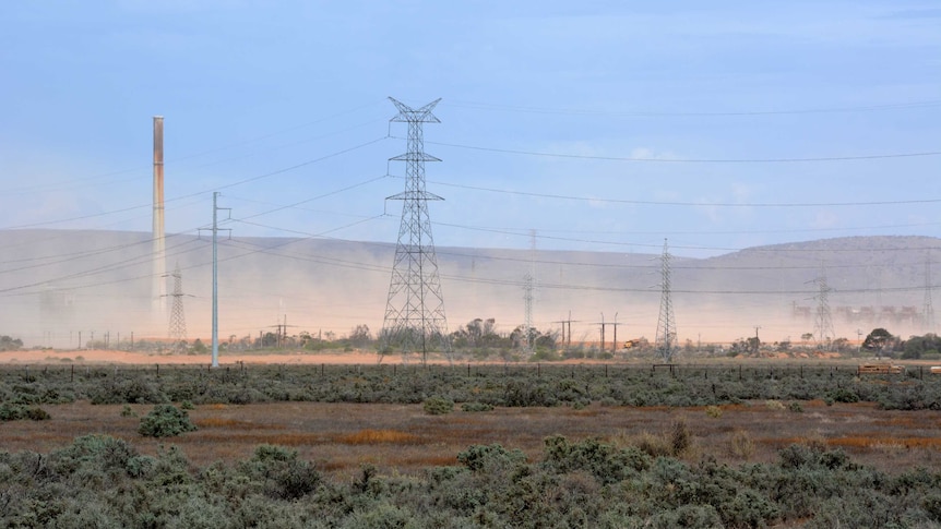 Brown dust clouds are seen rising up near power lines