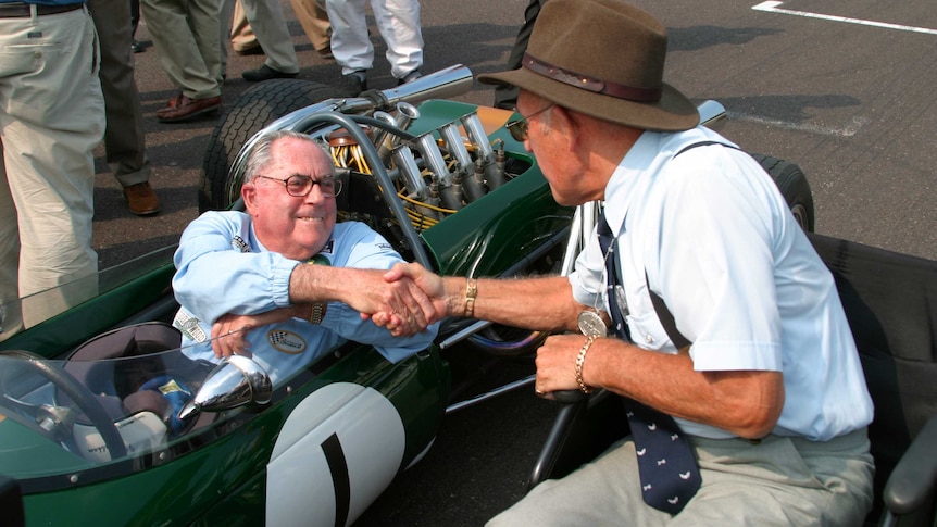 LtoR Former rivals Jack Brabham and Stirling Moss meet at the 2004 Goodwood Revival meeting.