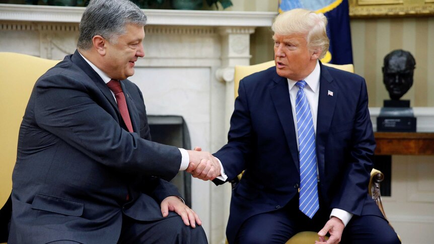 US President Donald Trump shakes hands with Ukraine's President Petro Poroshenko