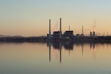 A view of Lake Liddell with the Liddell power station reflected in the background.