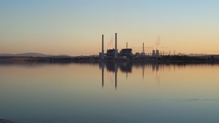 A view of Lake Liddell with the Liddell power station reflected in the background.