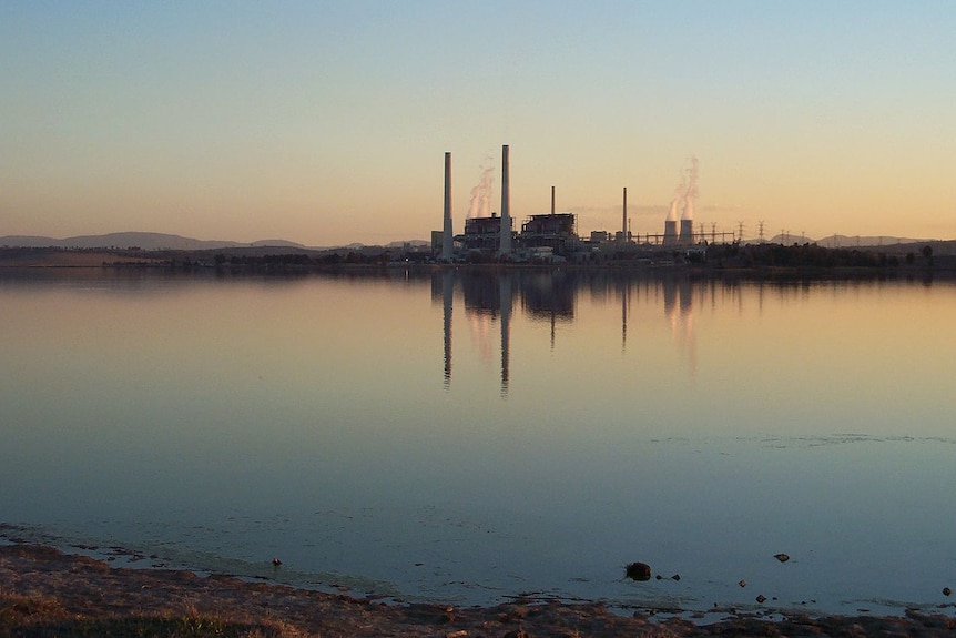 A view of Lake Liddell with the Liddell power station reflected in the background.