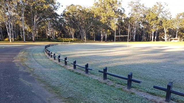 Frost covers the grass on an oval at Herberton.