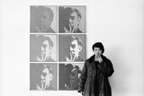 Ai Weiwei pictured with Andy Warhol's self-portraits at the Museum of Modern Art in 1987.