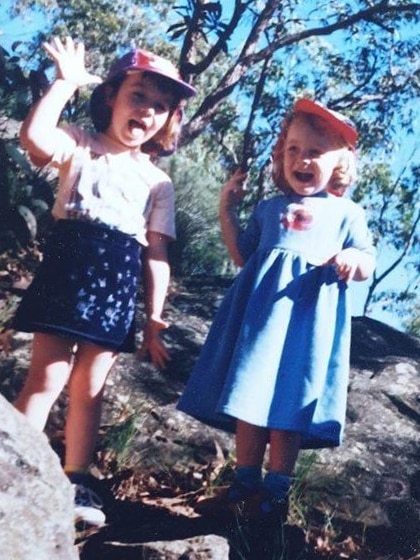 Amy White with her older sister Aelish White, pictured as children.