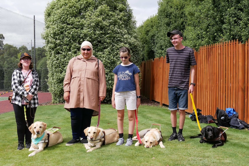 Camp participants and their trainee dogs