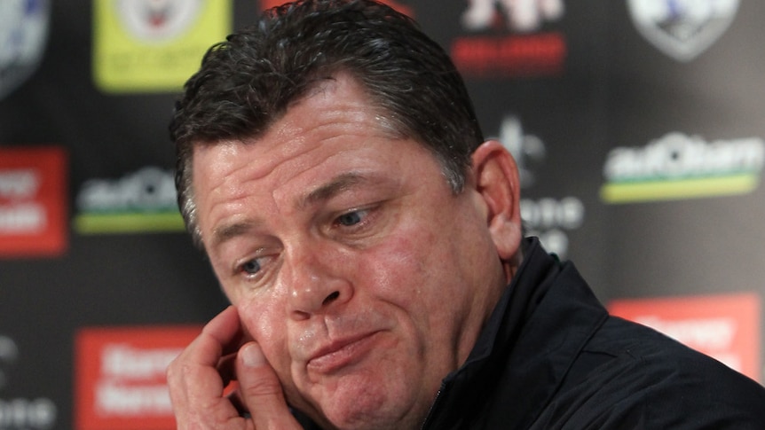 Former Bulldogs coach Kevin Moore looks downcast as he talks to a press conference in Adelaide.