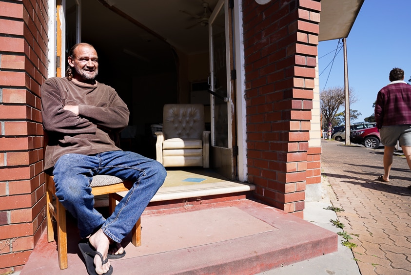 Local man Peter Kurray sits outside his Lucindale house on the main street the morning of the concert.